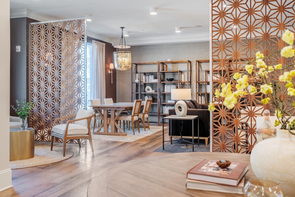 a living room and dining room with a table and chairs