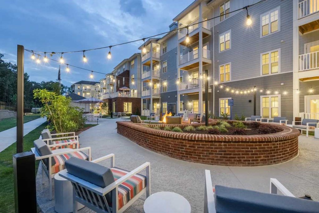 the preserve at ballantyne commons courtyard with patio furniture and string lights