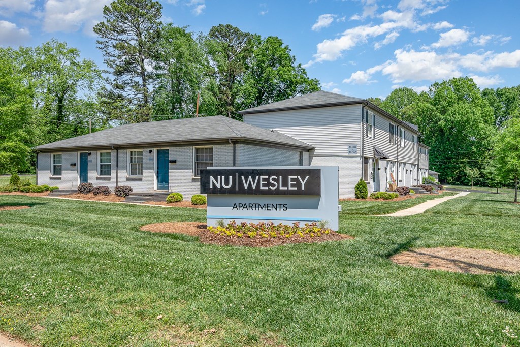 the preserve at nuweys apartments sign in front of a house