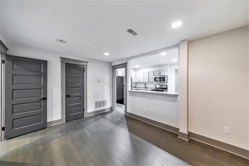 the living room and kitchen of a new home
