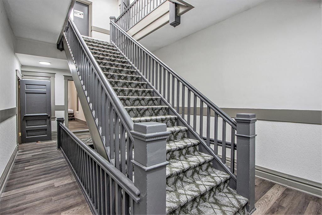the staircase in your home is decorated with gray railing and stairs
