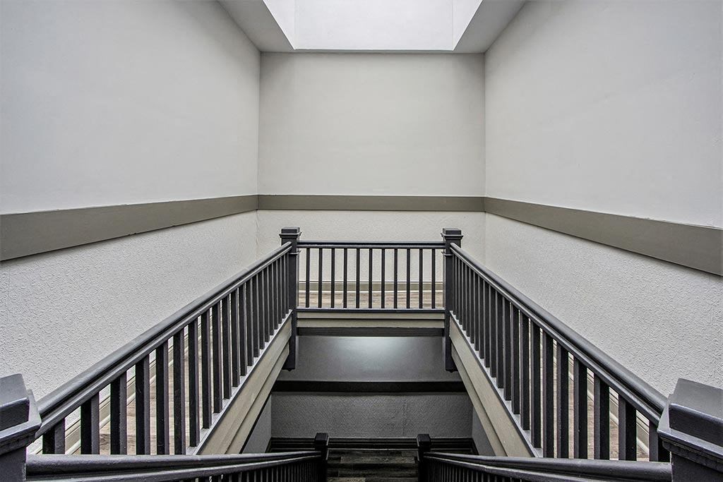 a view down the stairs in a building