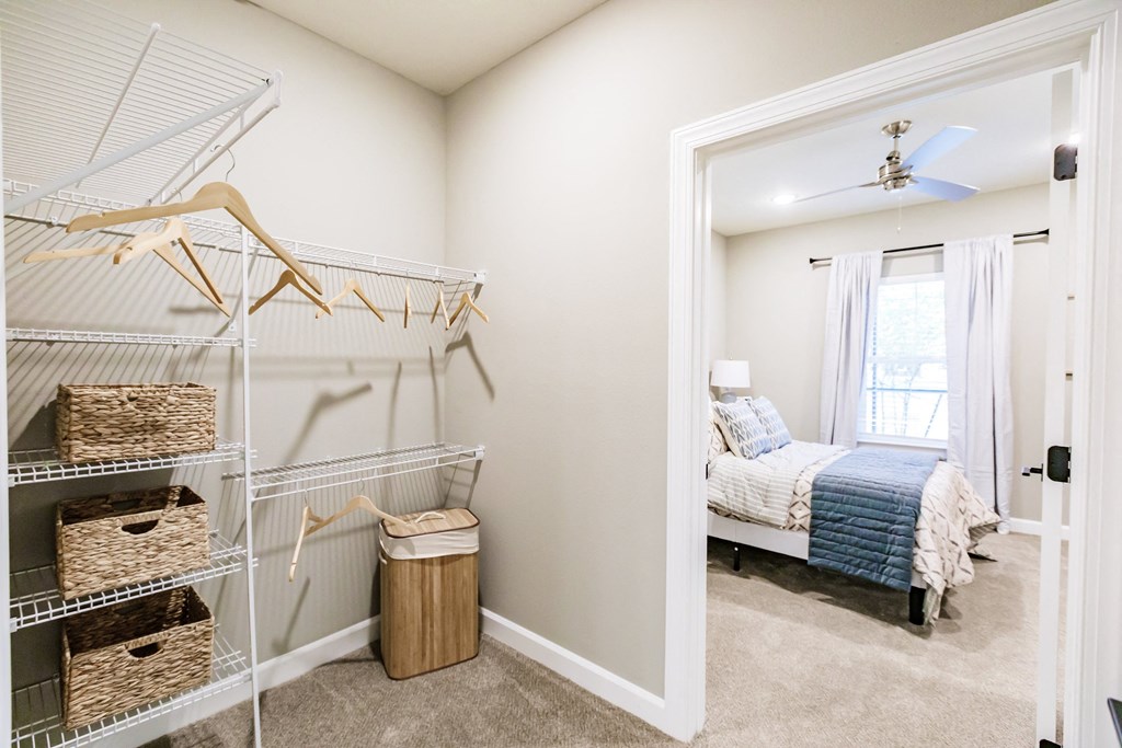 a room with a closet and a bed in it