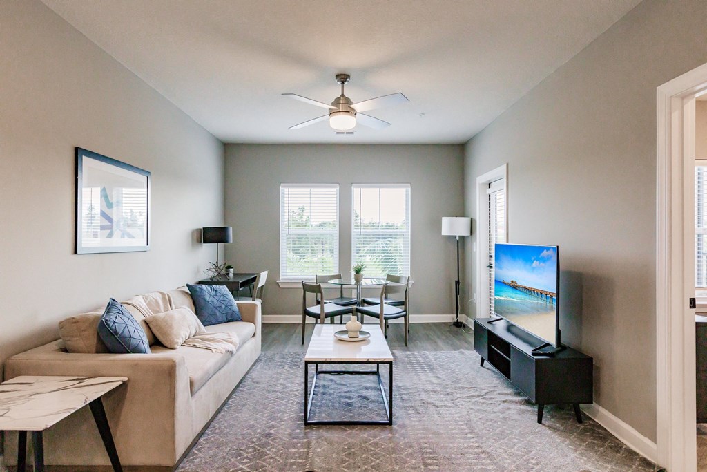 a living room with a couch and a tv