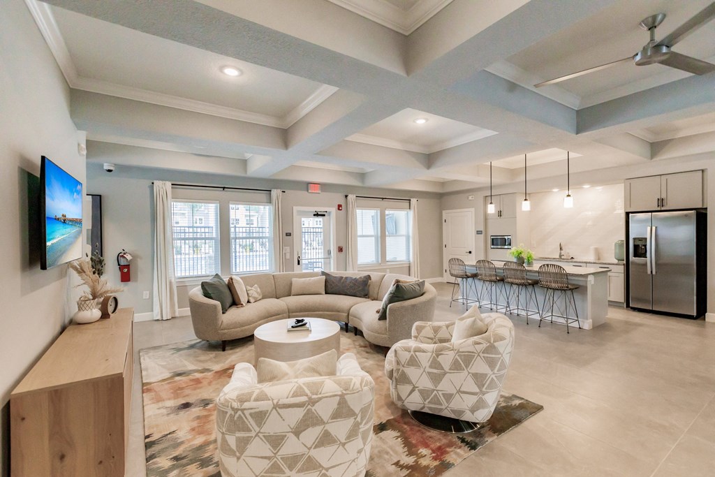 community lounge area with chairs and tables at Vantage Luxury Apartments in  Cape Coral, FL