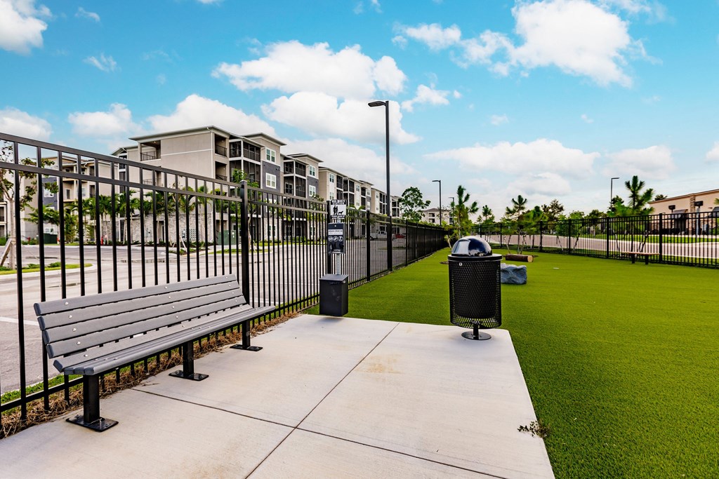 dog park with green turf and a fence at Vantage Luxury Apartments in  Cape Coral, FL