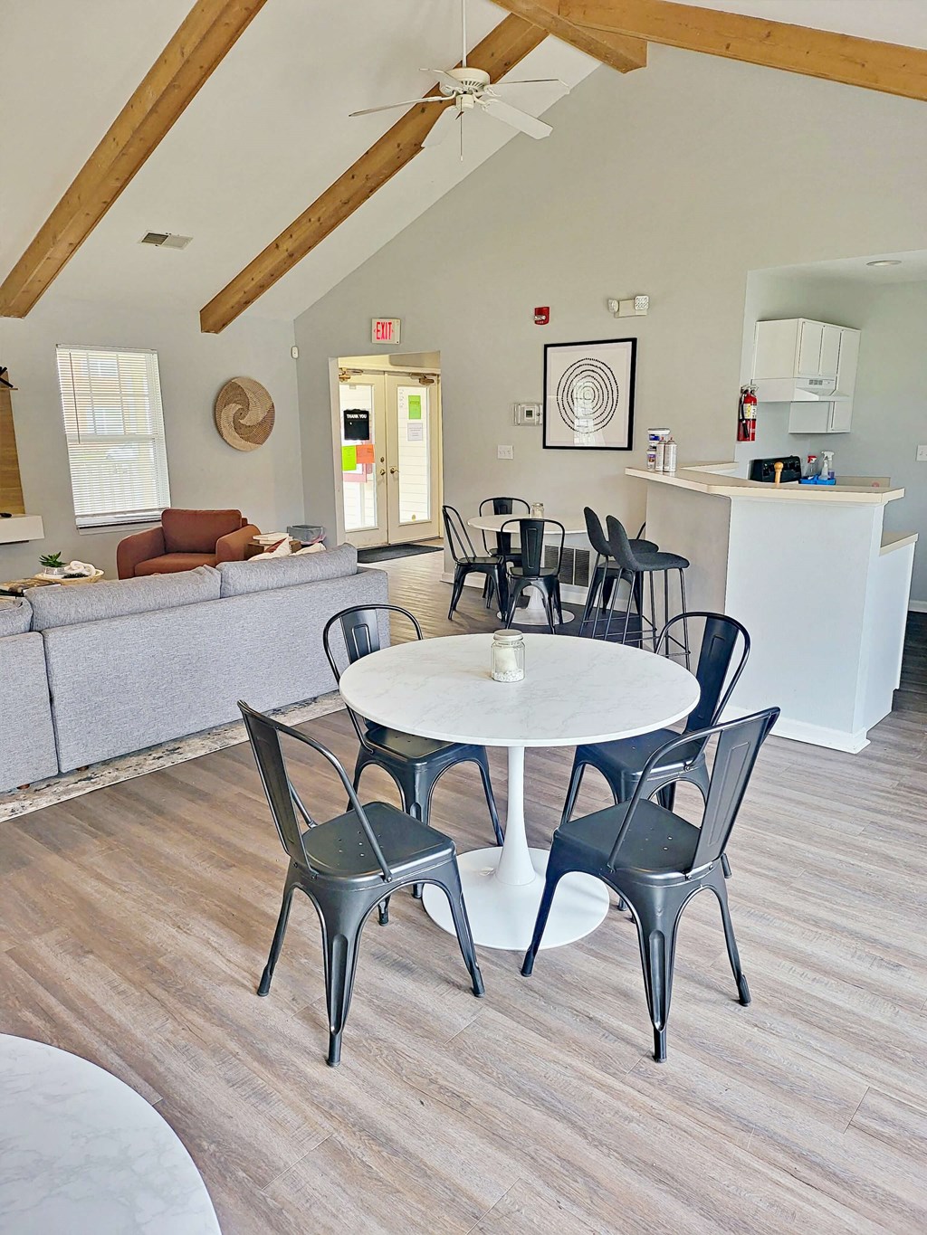a dining room and living room with a table and chairs