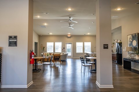 A well-lit dining room with a table set for six.