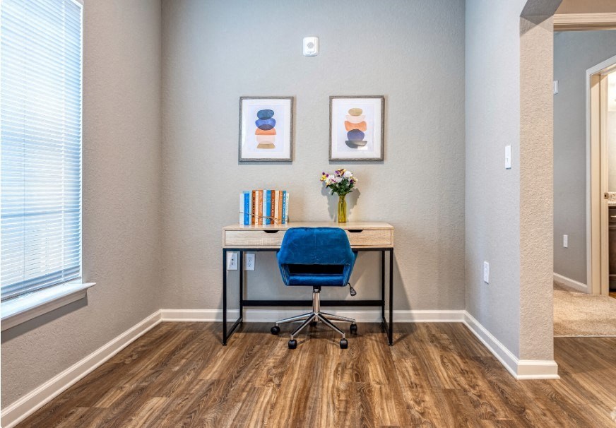 A chair and desk in a room at the Flats at Sundown in North Port, Florida