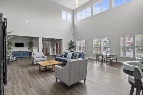 A living room with a grey sofa and a wooden coffee table.