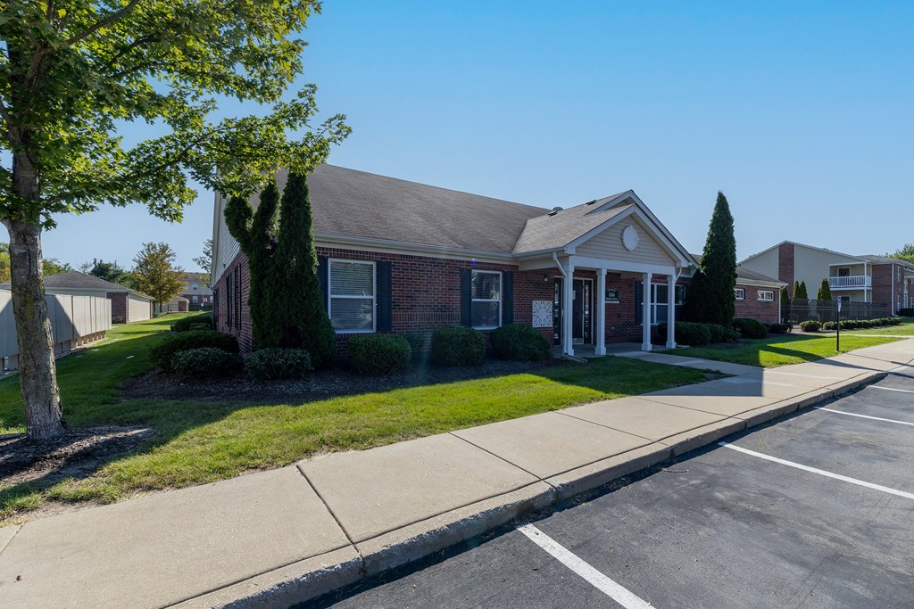 an exterior view of the retreat apartments clubhouse building in michigan city