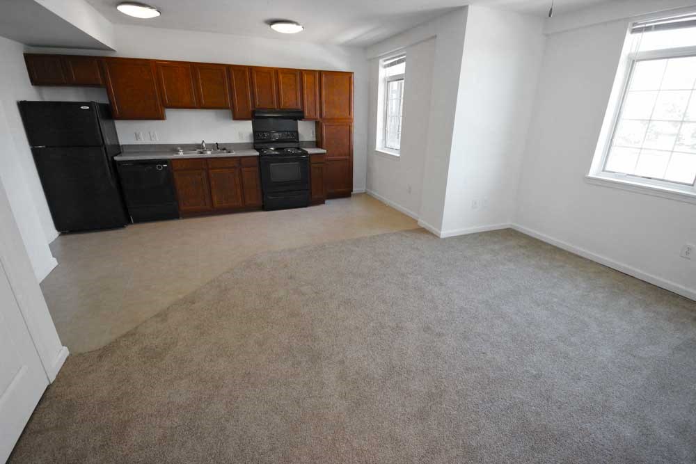 a kitchen with a stove a sink and a refrigerator