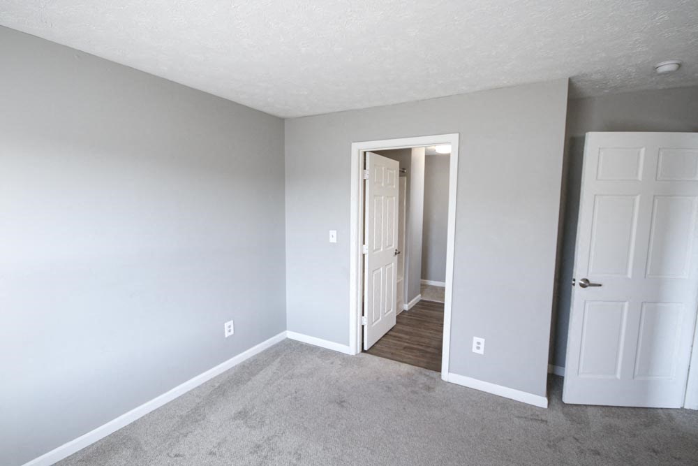 An empty bedroom with doorway at Cobalt Apartments in Kokomo, Indiana