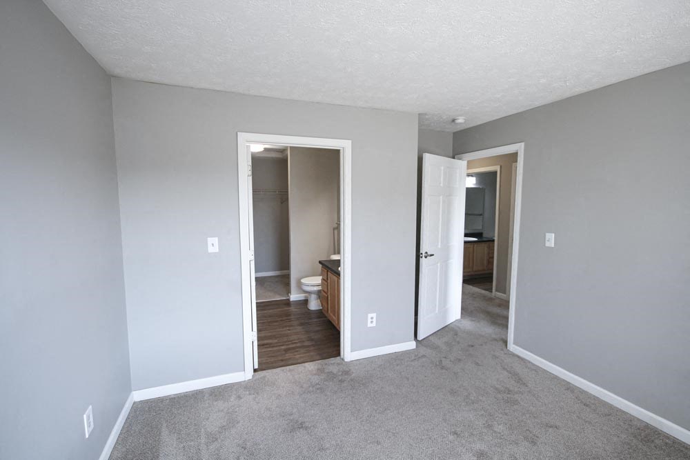 An empty bedroom with carpet and closet at Summerset Apartments in Kokomo, Indiana
