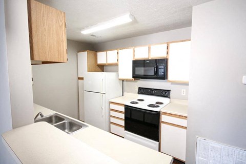 a kitchen with a stove and a sink
