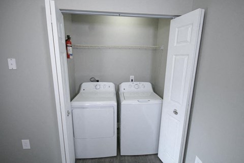 White washer and dryer in a room.