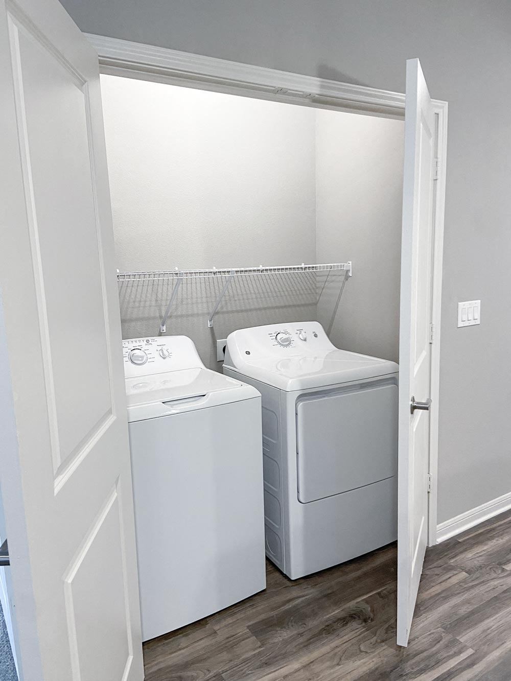 Washer and dryer in a closet at Promenade Luxury apartments in Beaumont, Texas