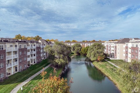 A pond surrounded by apartment buildings