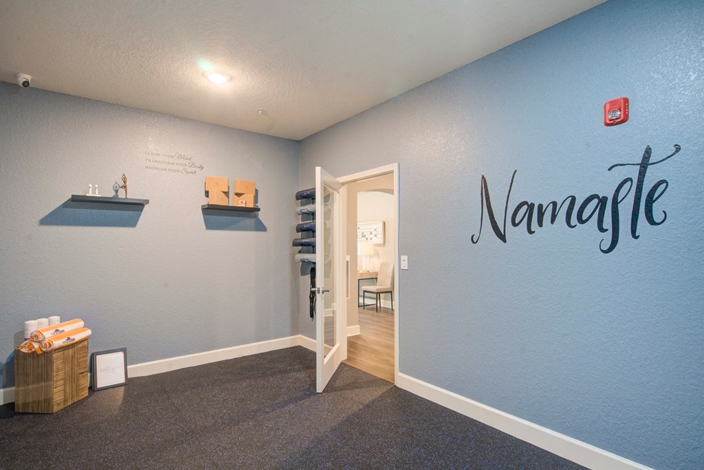 a room with a blue wall with a name on it