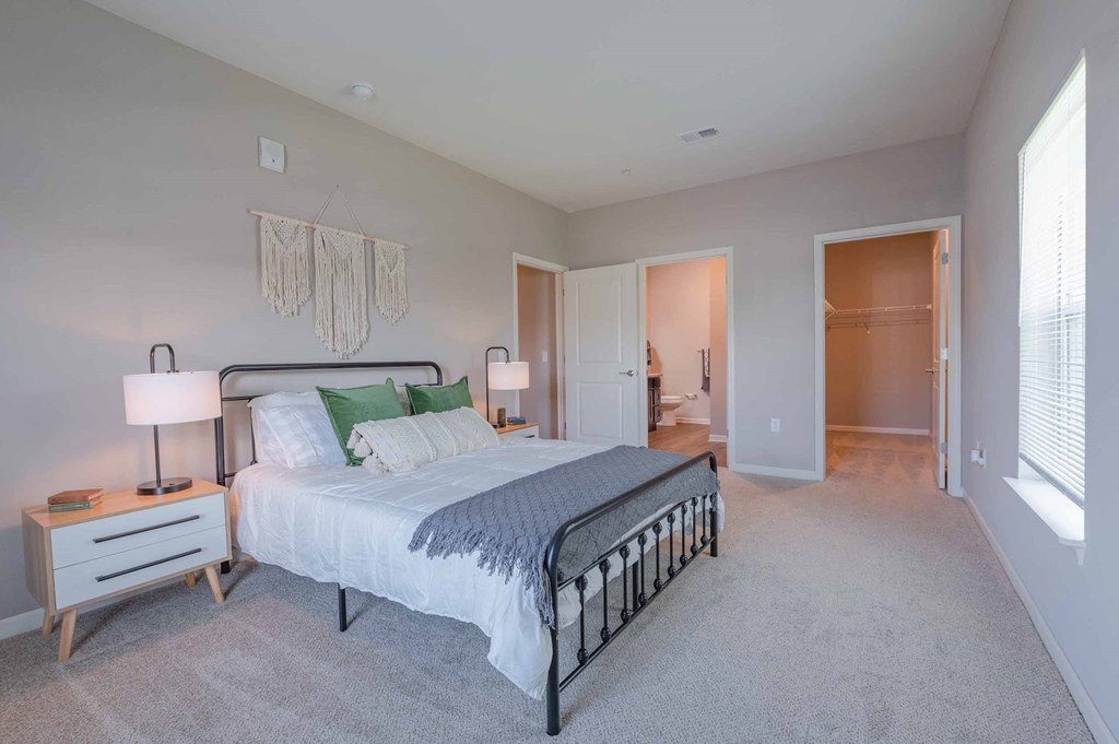 a bedroom with a bed and two night stands