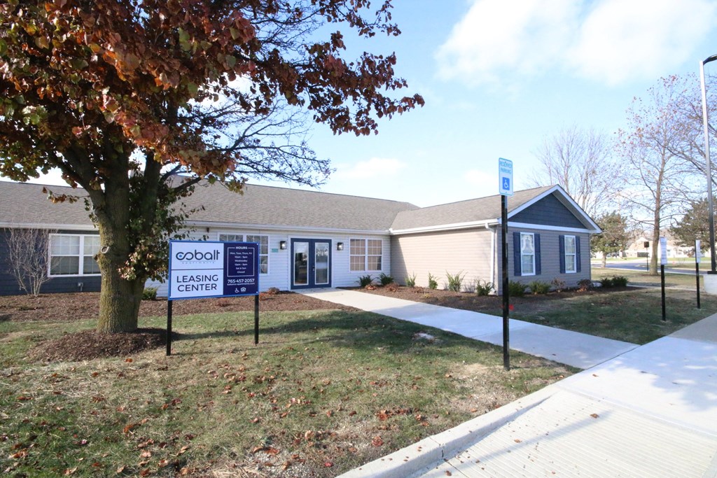 Cobalt Leasing Center with a tree in front.