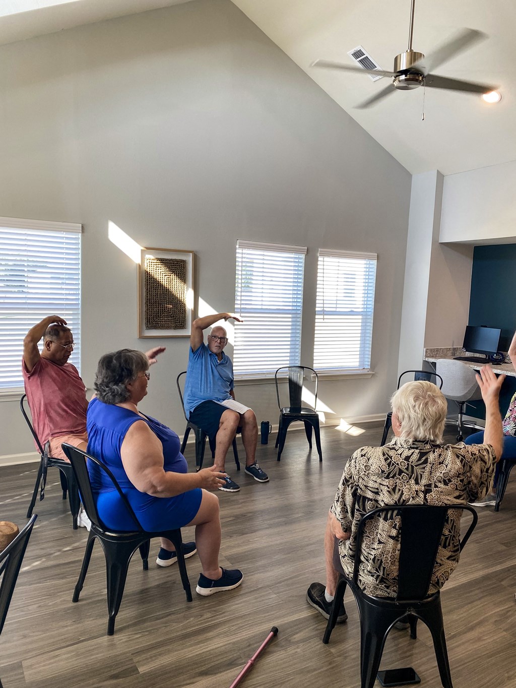 a group of people sitting in a circle in a room