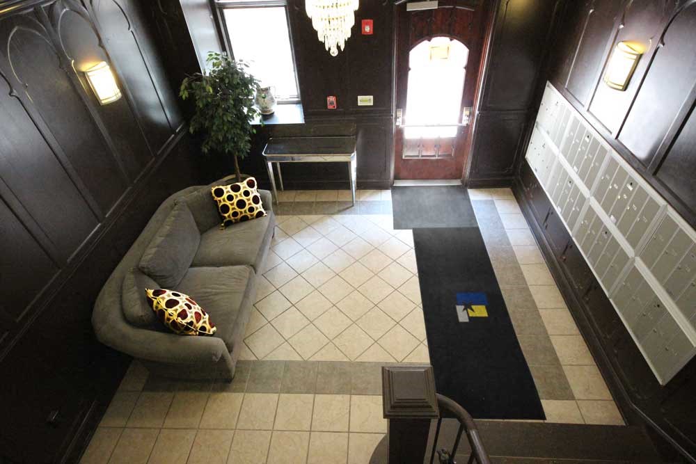an entry room with a couch and table