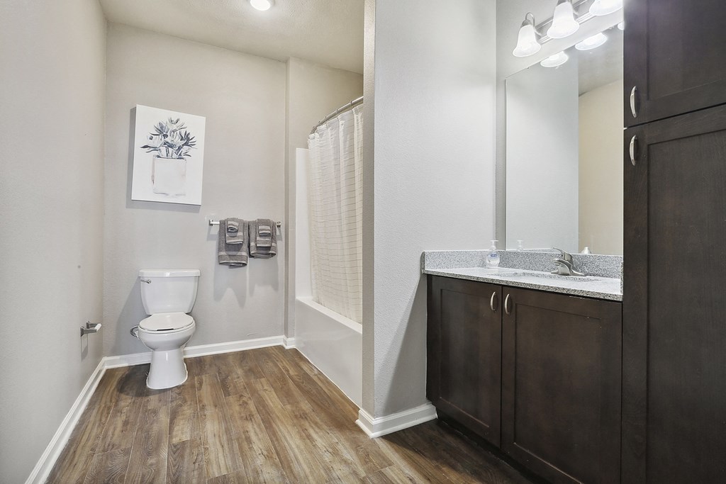 an empty bathroom with a toilet and a sink