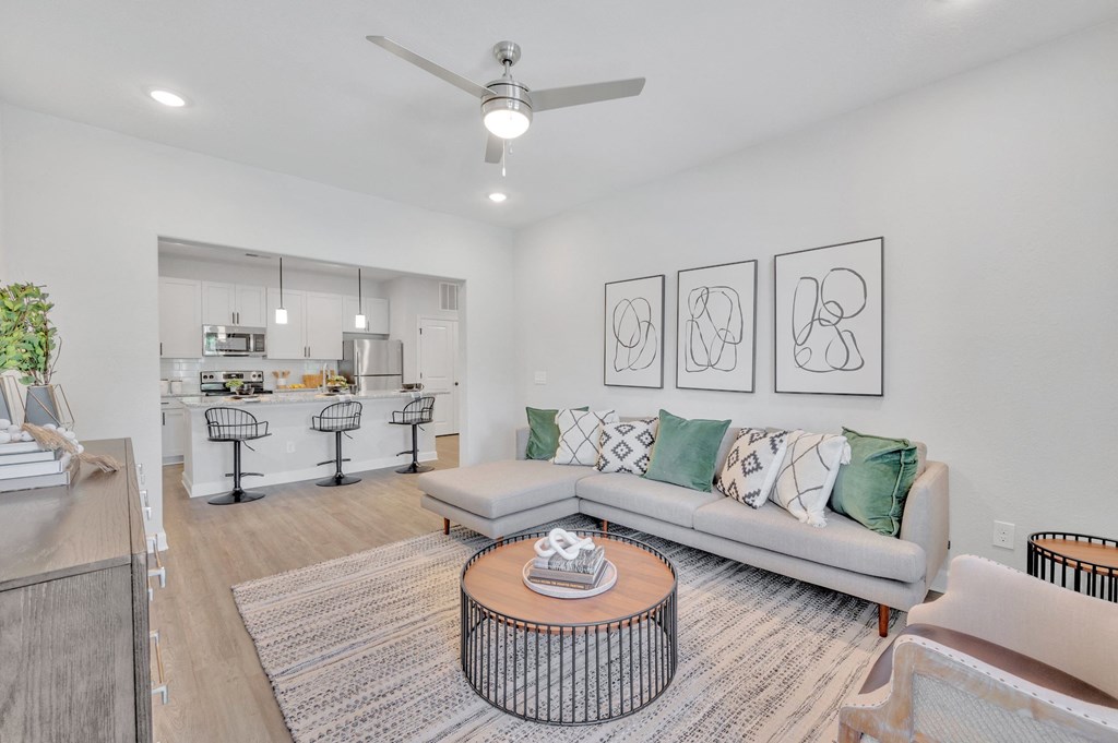 a living room with a couch and a coffee table at spire apartments