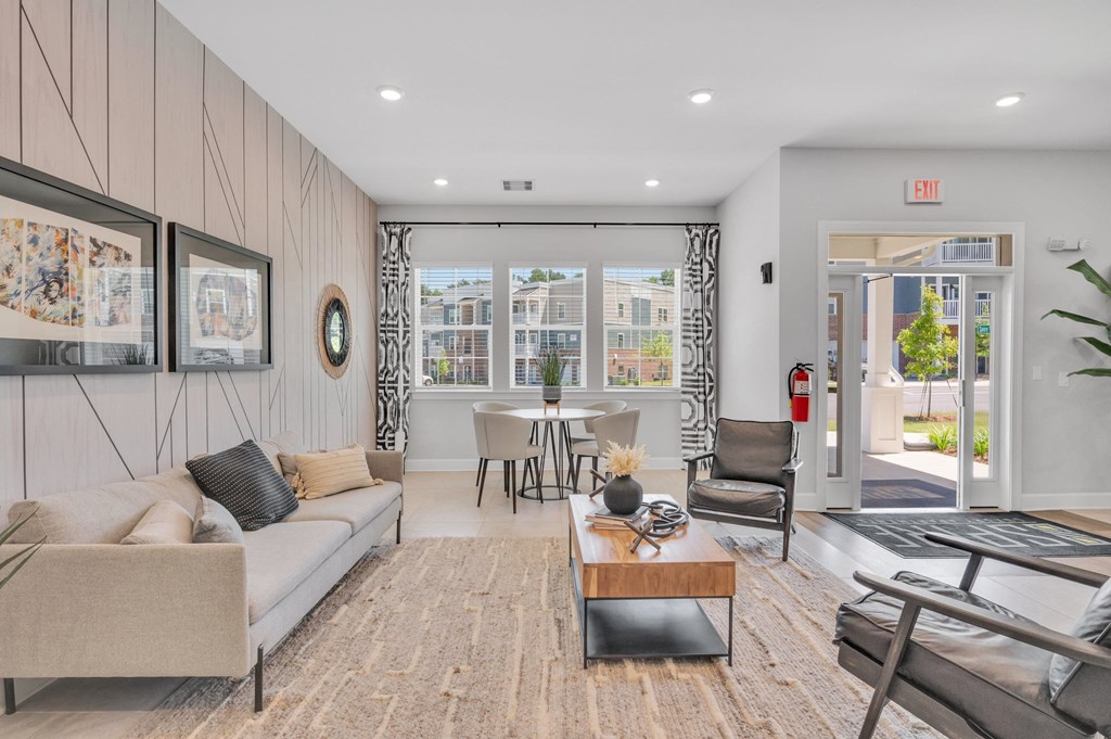 community living room with a couch and a table   at spire luxury apartments in charlotte nc