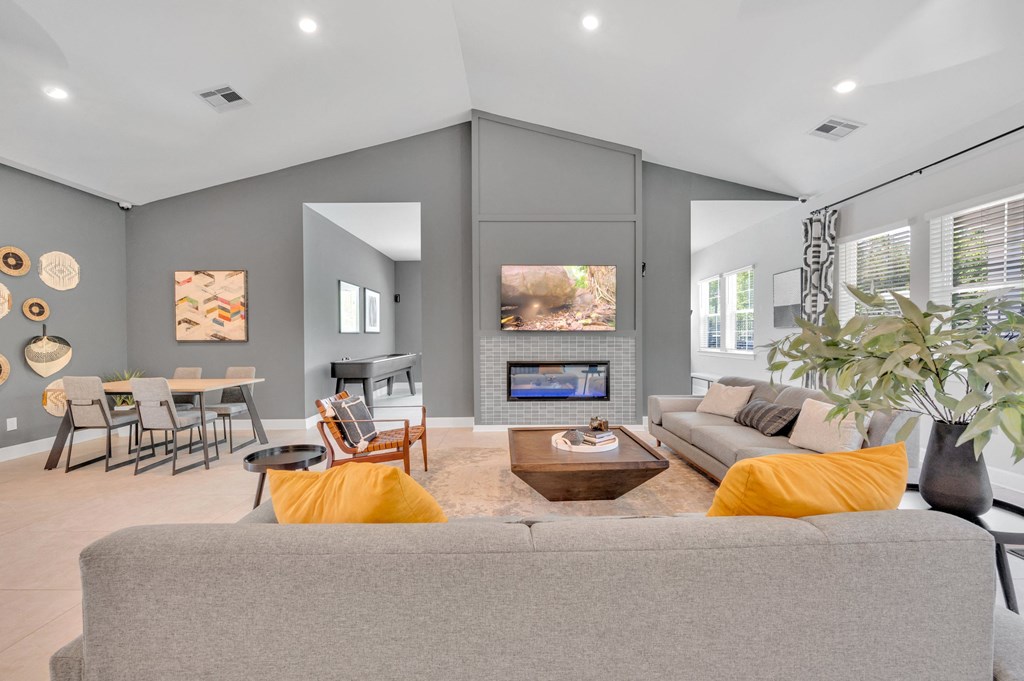 community living room with a couch and a fireplace at spire apartments in charlotte nc