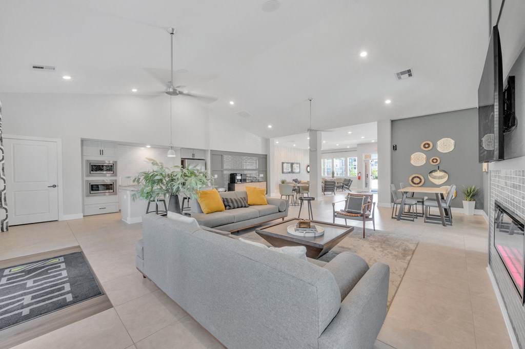 a living room with a couch and a table at spire apartments