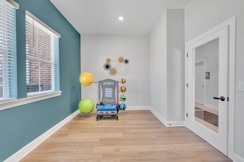 small room with exercise balls on a rack at spire apartments