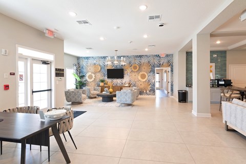 A modern living room with a dining table and chairs.