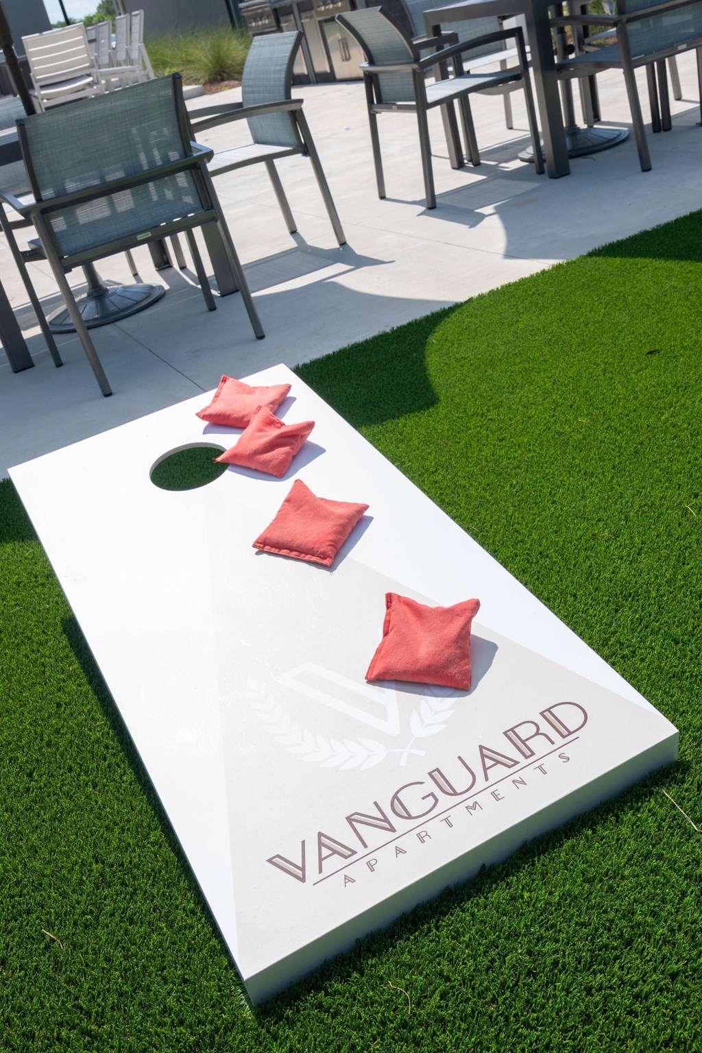 A white Vanguard branded box with a green circle and three red stars on it.