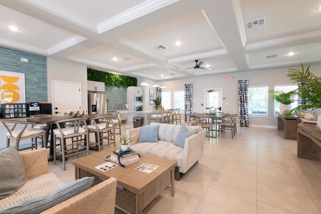 A living room with a couch, chairs, and a coffee table.