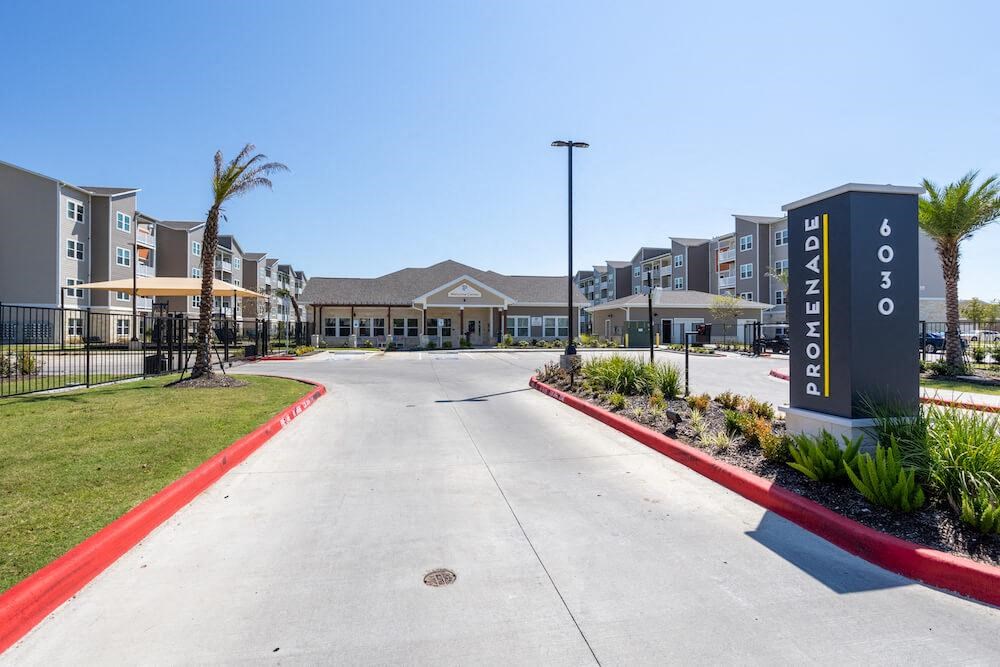 a parking lot with a building in the background