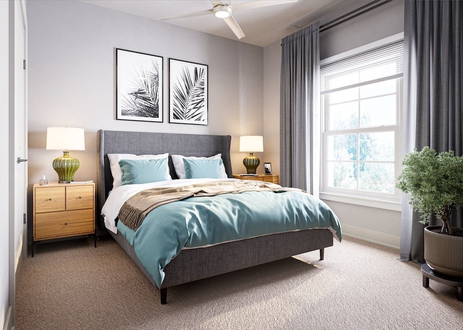 a bedroom with a bed and two night stands with lamps