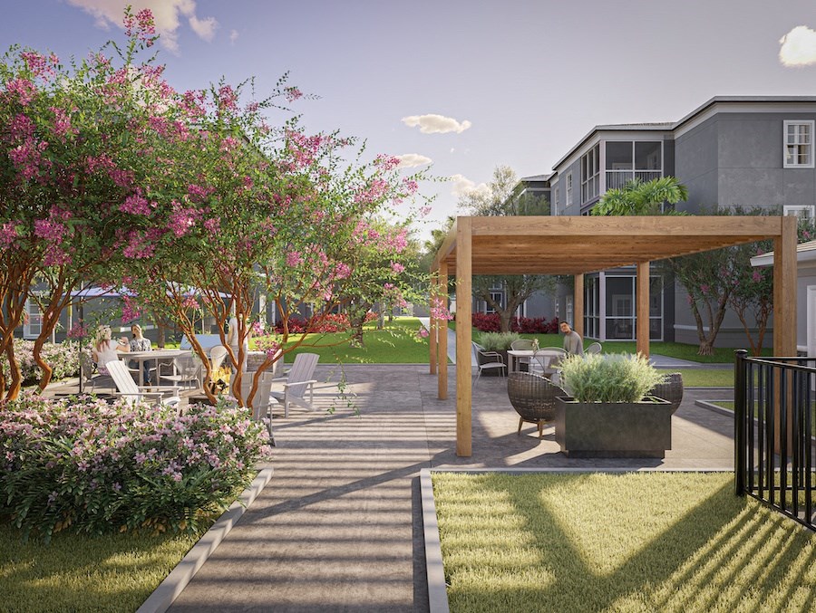 Rendering of Swiftwater apartments courtyard with a pergola and tables and chairs