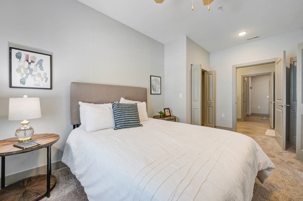 a bed with a night stand