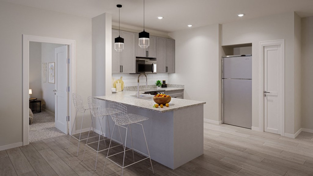 a kitchen with an island and a refrigerator