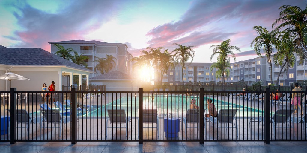 a pool with a fence in front of a building