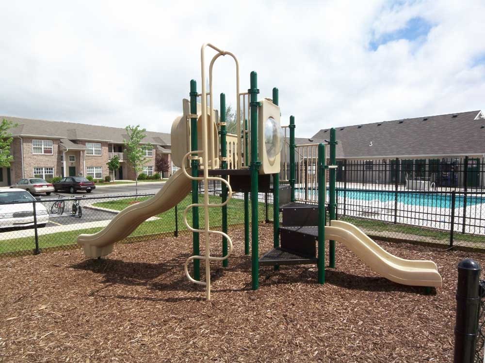 Playground with two slides at Canterbury House apartments in Warsaw, IN