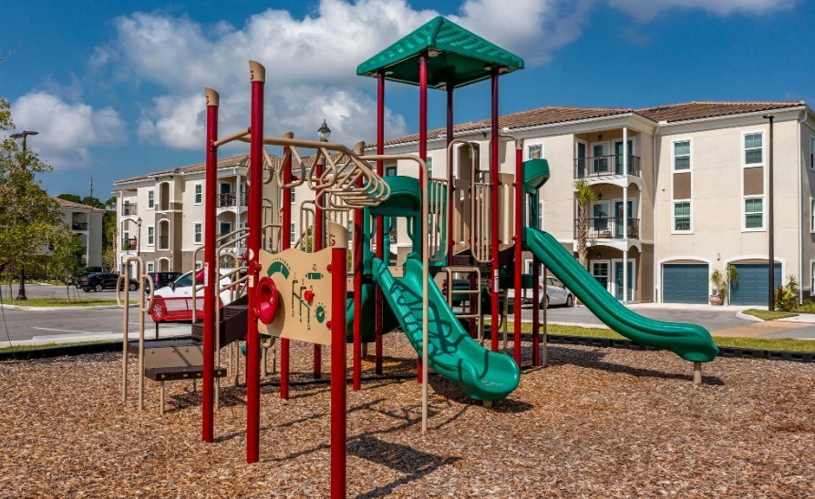 the playground with slides and climbing rungs at the Flats at Sundown in North Port, Florida