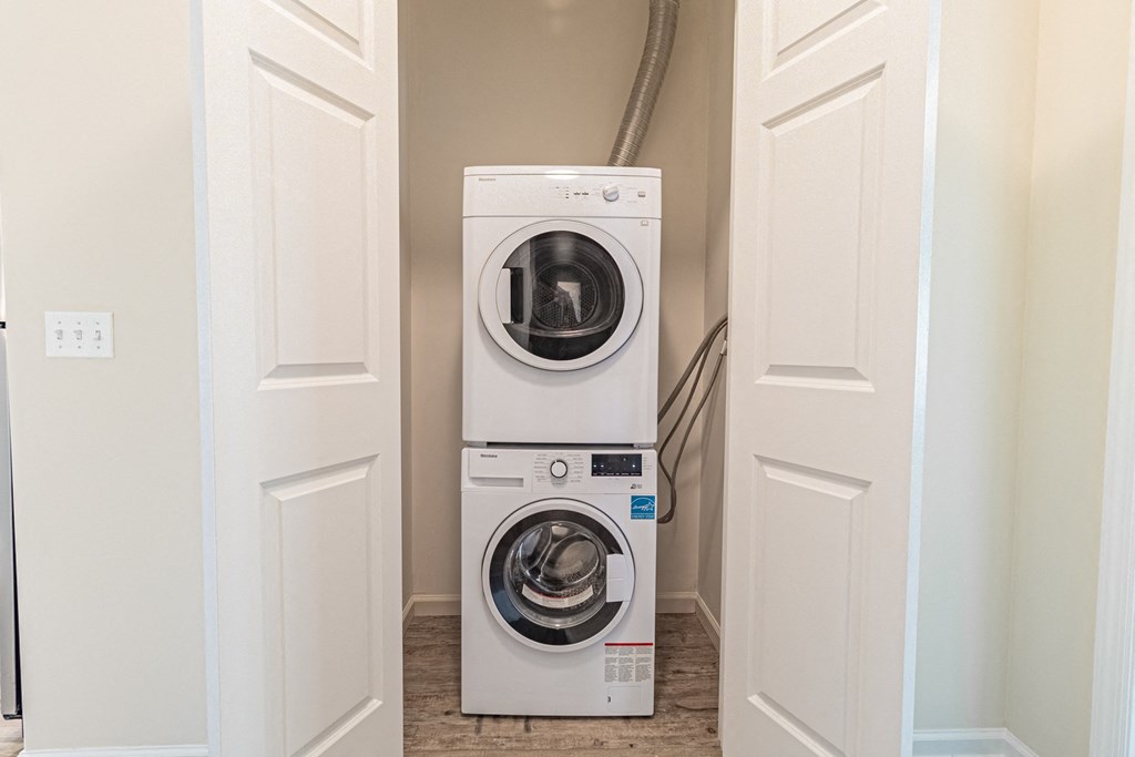 a front loading washer and dryer in a laundry room