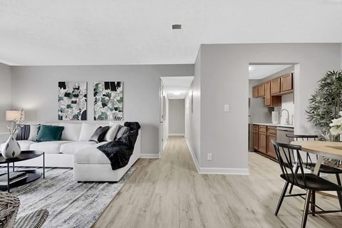 a spacious living room with gray walls and hardwood floors at Stonewater Apartments, Kentucky, 40241
