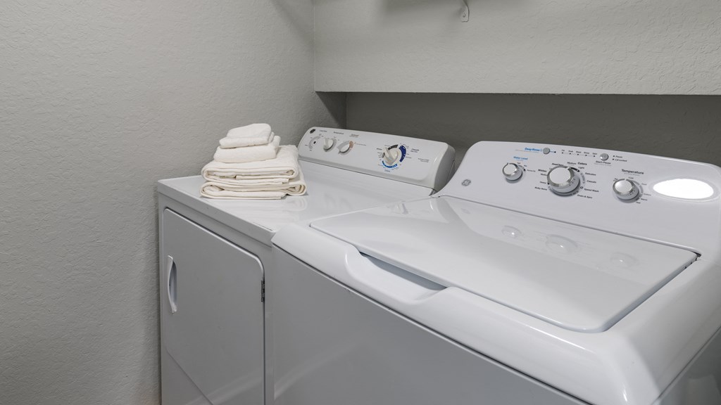 a washer and dryer in the laundry room of a house