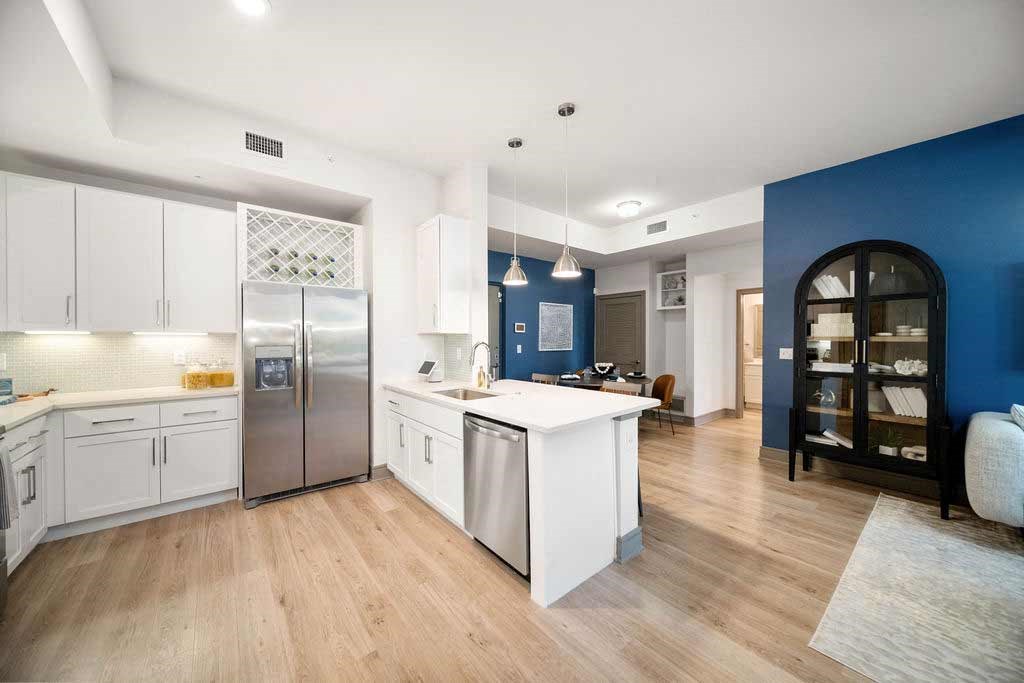 a large kitchen with a blue and white