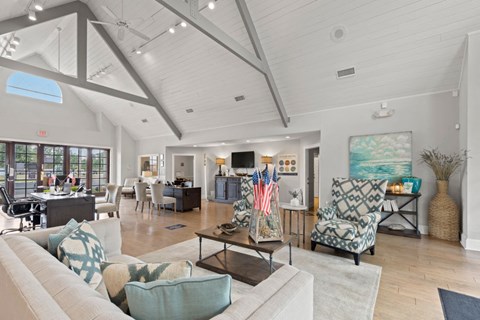 A living room with a white couch and a coffee table.
