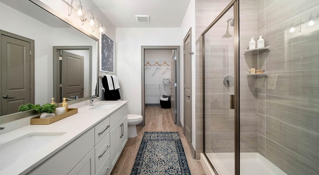 a bathroom with a shower and a sink